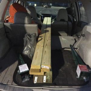 Hauling sign post materials in the Subaru.